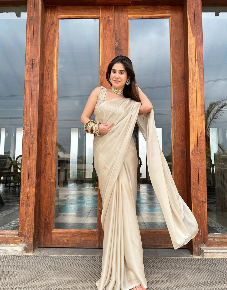 Tan gold laser georgette saree with oat golden blouse