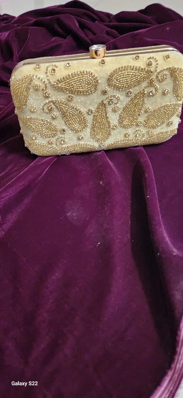 white purse with golden embroidered
