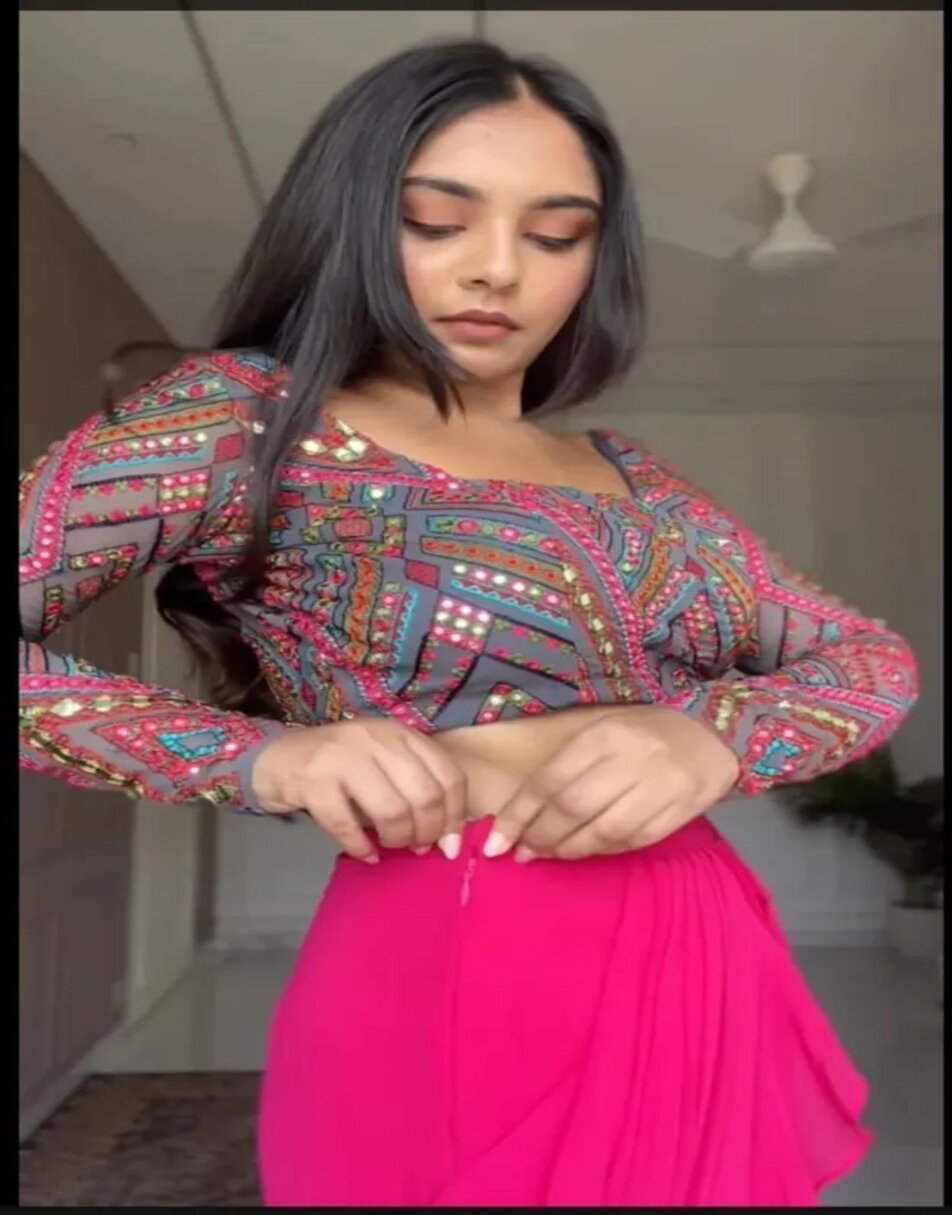 Embroidered blouse with pink ruffle saree