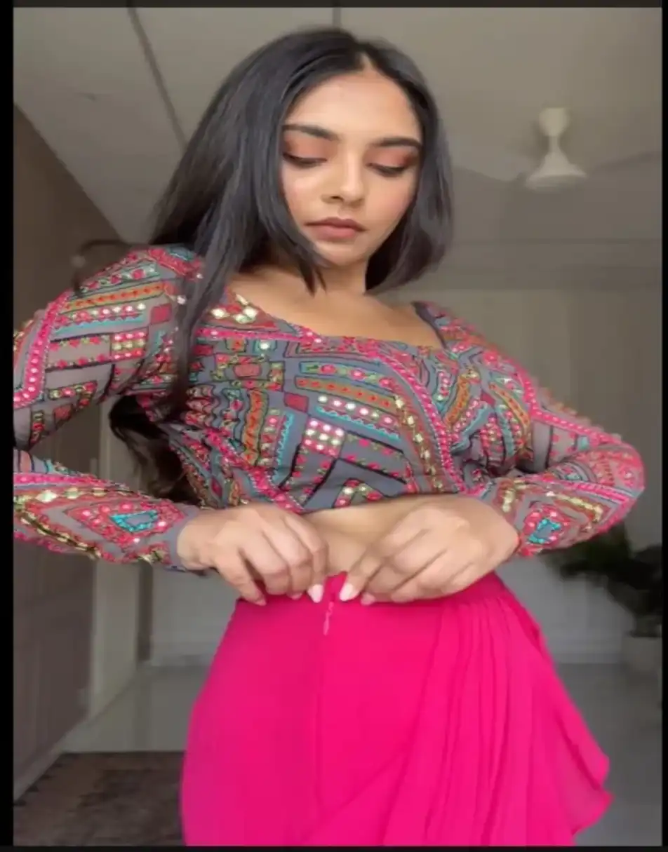 Embroidered blouse with pink ruffle saree