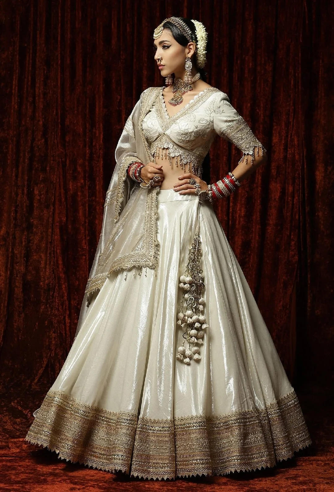 White tissue lehenga choli with heavy embroidery lace work