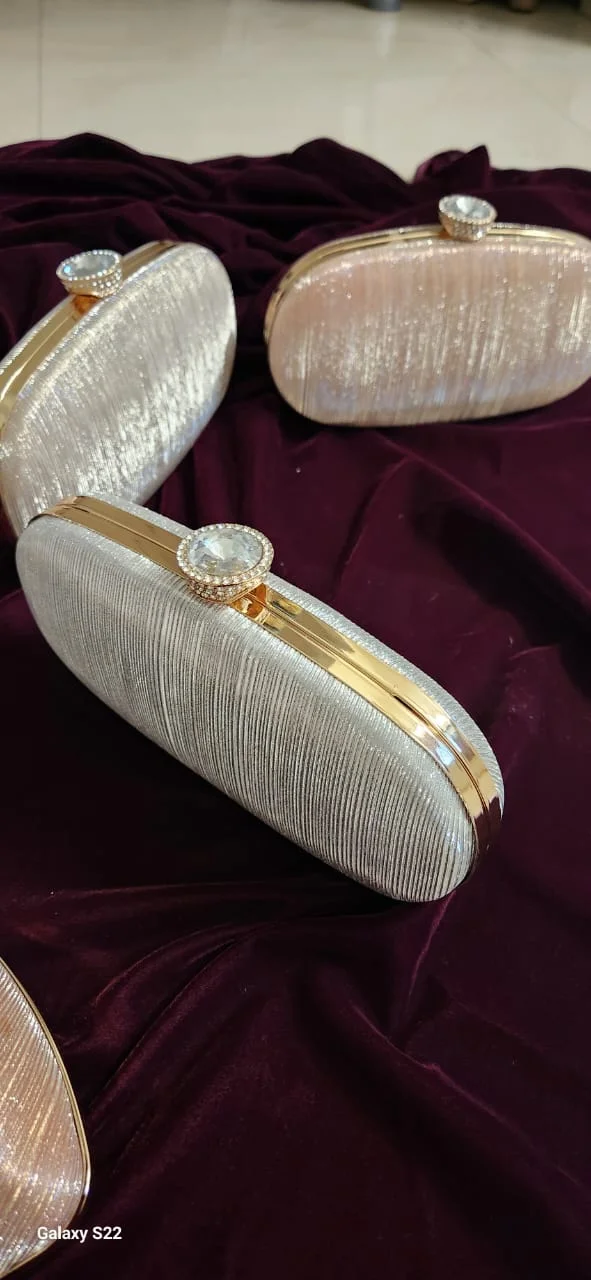 Oval shimmer box clutch